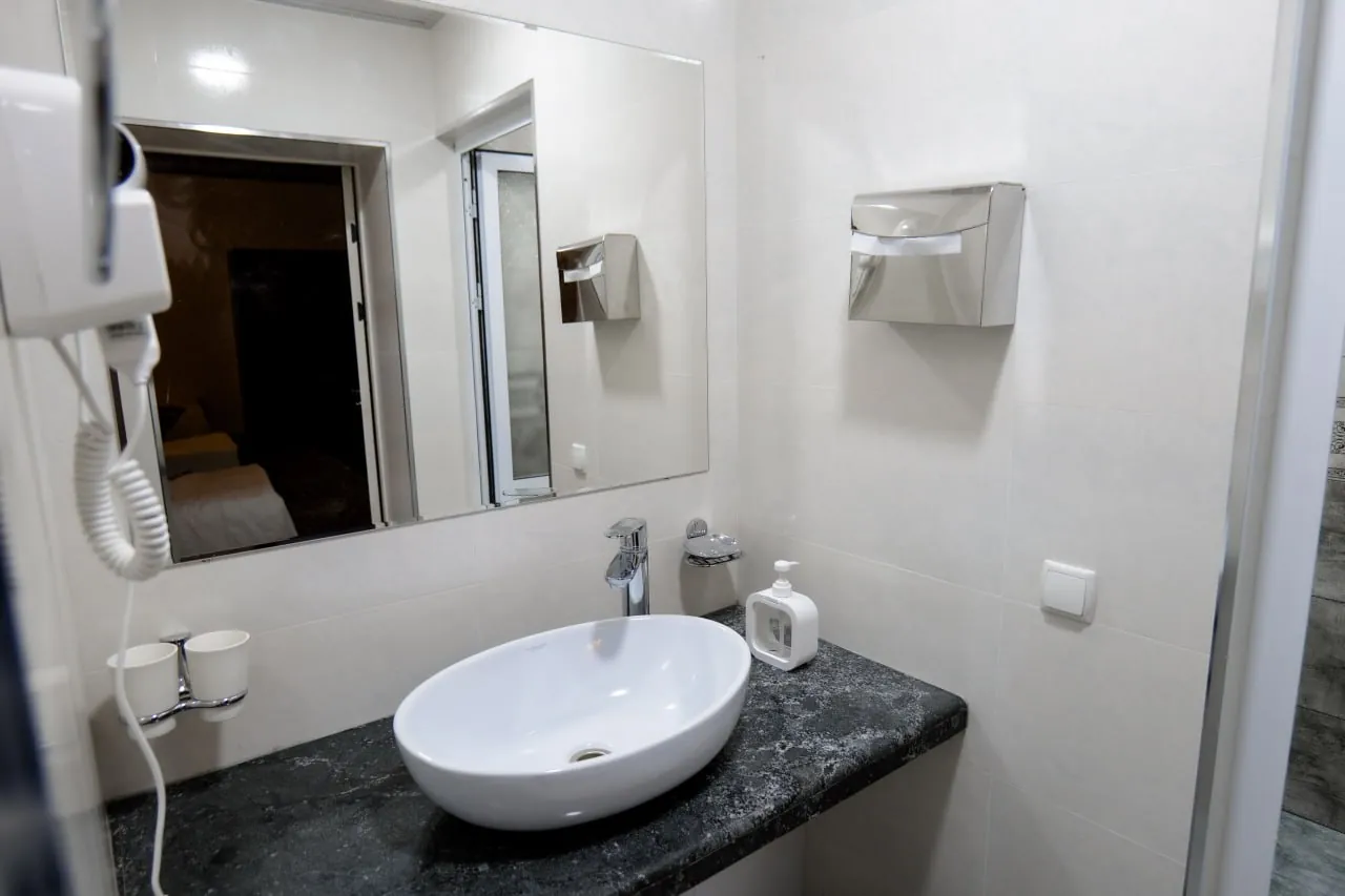 Private bathroom with a vessel sink