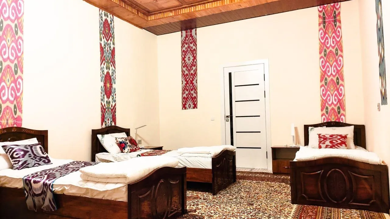 Shared room with three beds